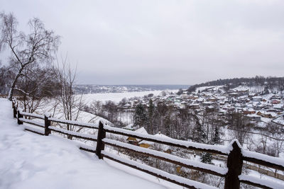 Scenic view of snow covered landscape against sky