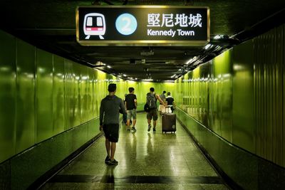 People in subway tunnel