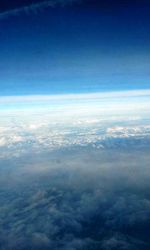 Aerial view of landscape against cloudy sky