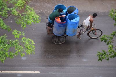 High angle view of man riding bicycle on street