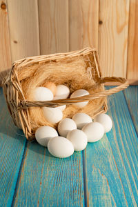 High angle view of eggs in basket on table