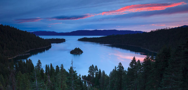 Scenic view of lake against sky at sunset