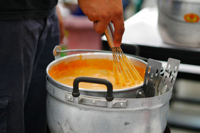 Close-up of person preparing food