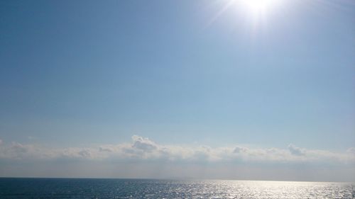 Scenic view of sea against sky on sunny day