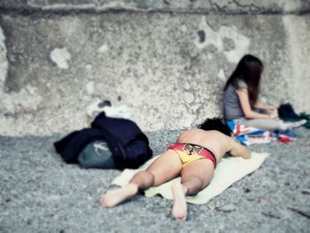 Young woman lying down on floor