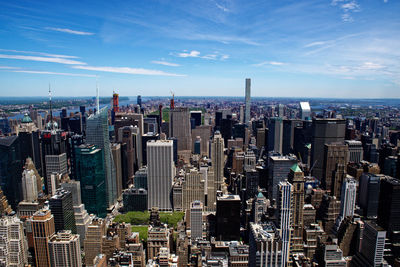 Aerial view of modern buildings in city against sky