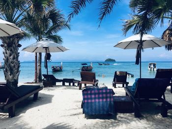 Lounge chairs and tables at beach