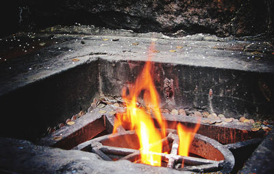 High angle view of fire on wood