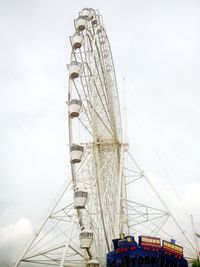 Low angle view of ferris wheel against sky