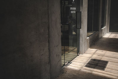 Man standing by window in building