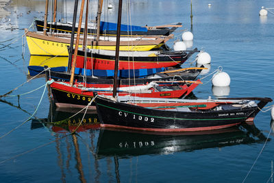 Boats moored at harbor