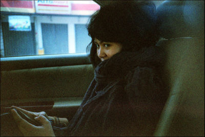 Portrait of a young woman looking away