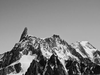 Scenic view of snowcapped mountains against clear sky