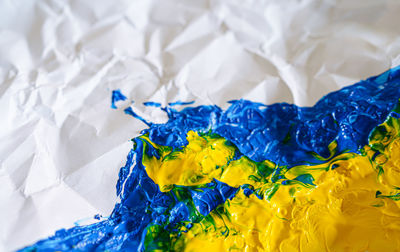 Yellow and blue colors on the folded paper