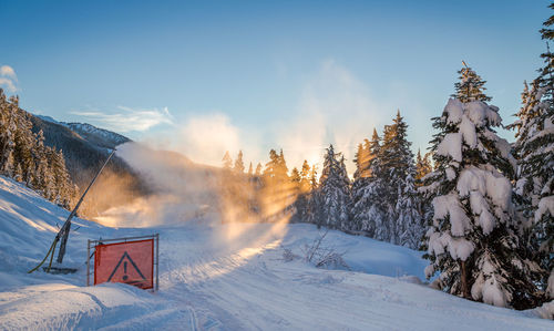 Scenic view of snow covered mountains against sky