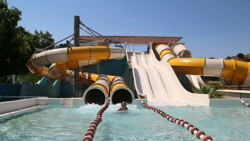 View of swimming pool against clear blue sky