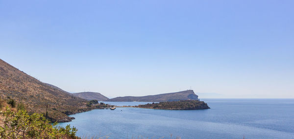 Scenic view of sea against clear blue sky