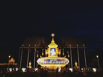 Group of people in front of building at night