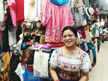 Woman standing at clothing store