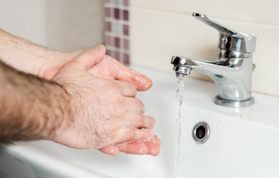 Midsection of man in bathroom