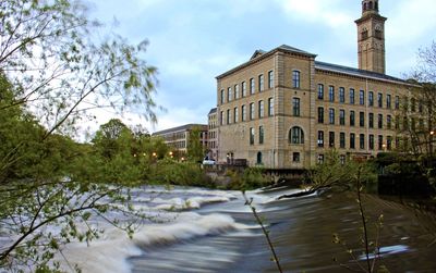 Buildings in city against sky