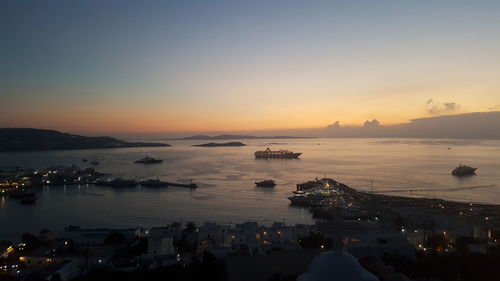 View of boats in sea at sunset