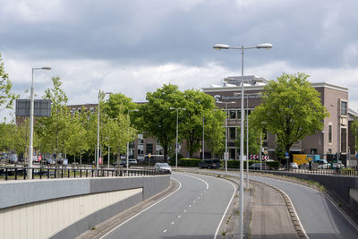 View of street against cloudy sky