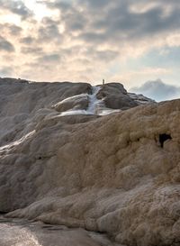 Rock formation on land against sky