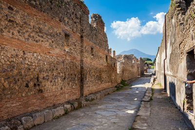 The streets of pompeii made of large blocks of black volcanic rocks