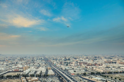 Aerial view of city against sky