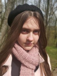 Portrait of young woman in hat