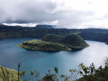 Scenic view of lake and mountains against sky