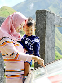 Full length of boy looking at camera