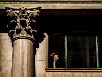 Low angle view of statue on flower