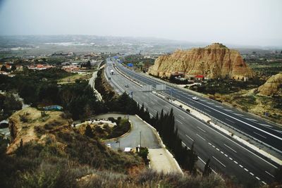 High angle view of cars moving on landscape