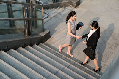 High angle view of people at staircase