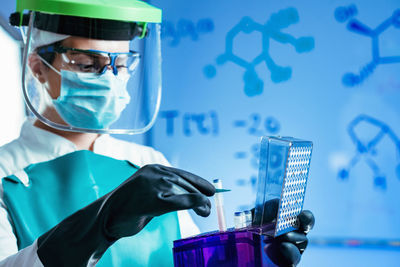 Female scientist experimenting in laboratory