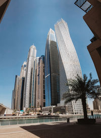 Low angle view of modern buildings against sky
