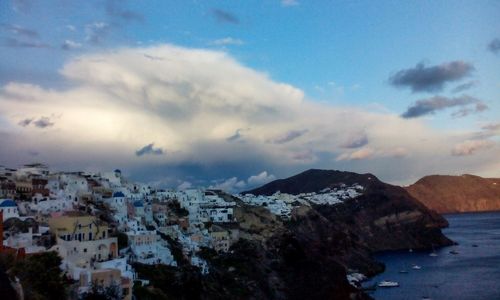 Mountain range against cloudy sky