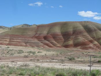 Rock formations on landscape against sky