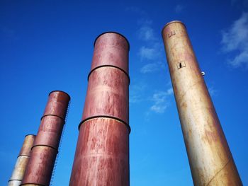 Low angle view of smoke stack against sky