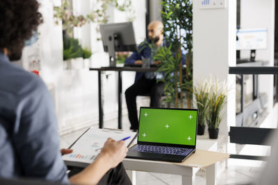 Man using laptop at office