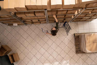 High angle view of man standing on steps