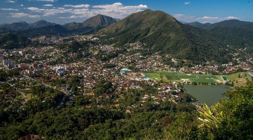 High angle view of townscape and mountains against sky