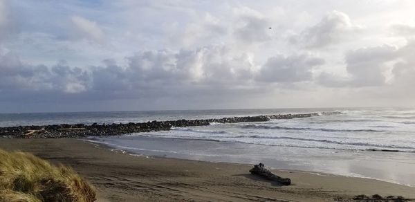 Scenic view of beach against sky