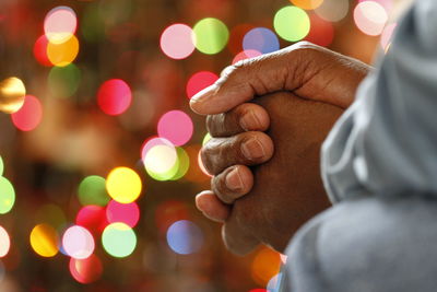 Close-up of hand holding illuminated lights