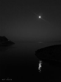 Scenic view of sea against sky at night