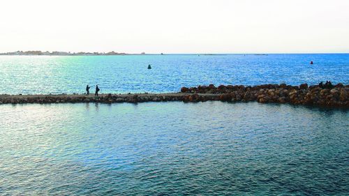 Scenic view of sea against clear sky