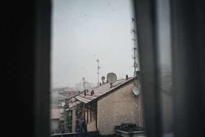 Buildings seen through glass window