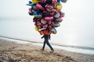 Full length of man standing on beach